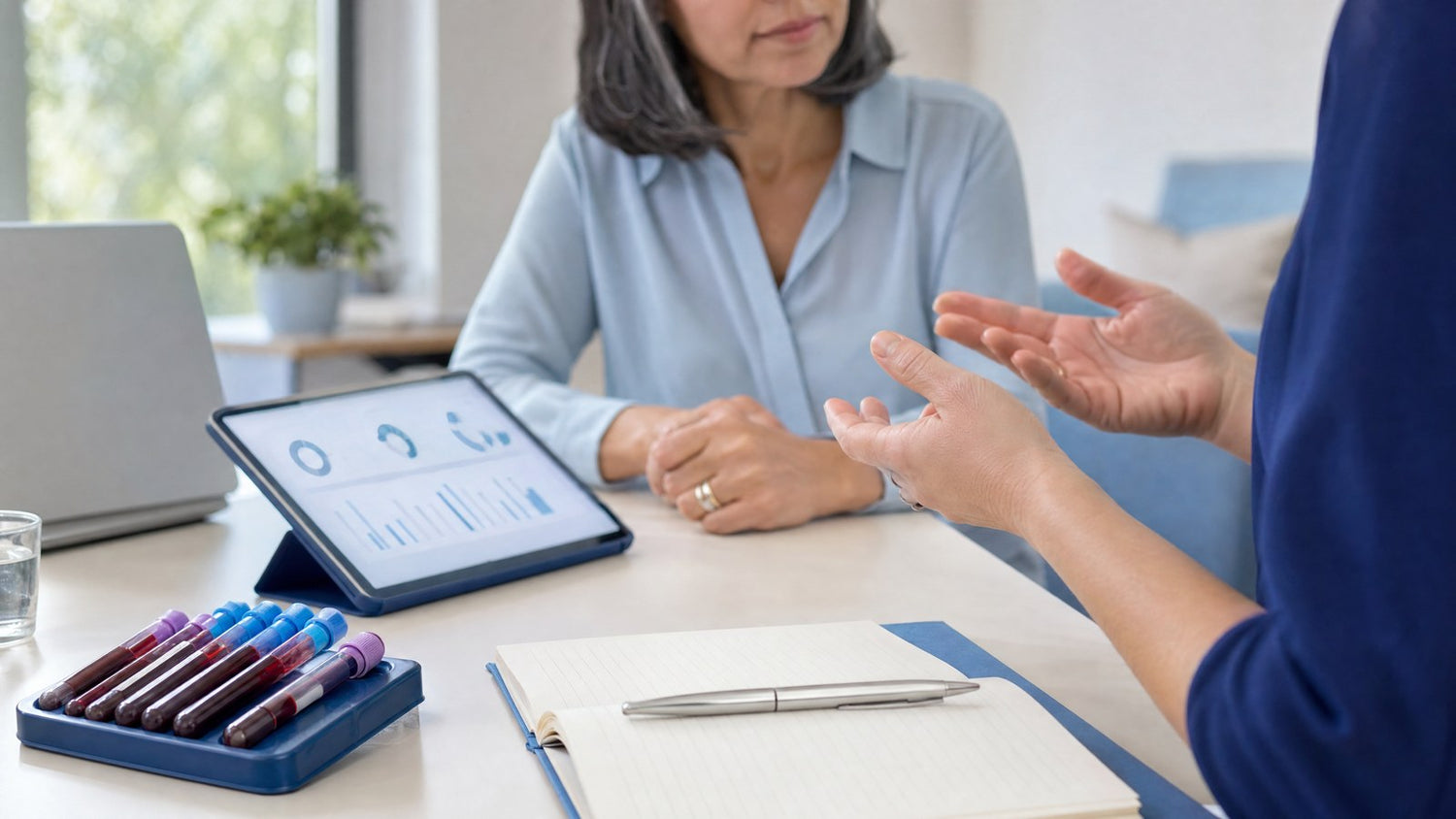 A healthcare professional discussing personalised IVF preparation with a patient based on their IVF and STI Pre-Screening…